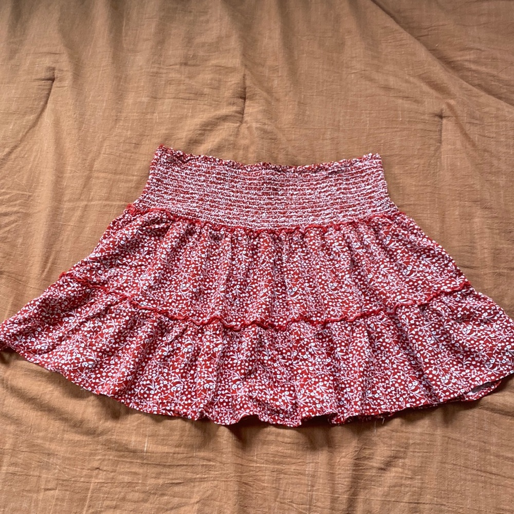 Red mini skirt it says large but it fits like a small, floral details